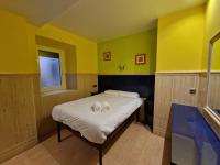 A bed or beds in a room at Pension Izar Bat Guesthouse