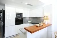 Kuchyň nebo kuchyňský kout v ubytování Tropical Flavour Apartment