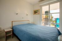 Posteľ alebo postele v izbe v ubytovaní Coté Jardin, Villa de Cap Esterel