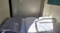 Łóżko lub łóżka w pokoju w obiekcie Chalet avec patio en Haute Corse 5 couchages