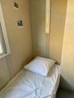 Łóżko lub łóżka w pokoju w obiekcie Chalet avec patio en Haute Corse 5 couchages
