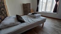 Łóżko lub łóżka w pokoju w obiekcie STUDIOS ET APPARTEMENTS EN CENTRE VILLE Boulogne sur mer
