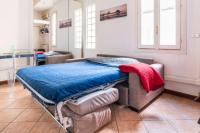 A bed or beds in a room at Grazioso