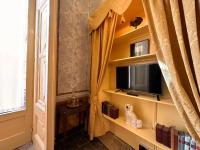 Televízia a/alebo spoločenská miestnosť v ubytovaní Casa Santangelo Suites