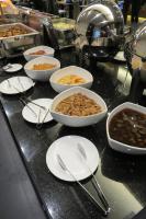 a buffet with bowls of food on a table at Chateau-Rich Hotel in Tainan