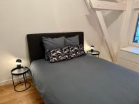 Posteľ alebo postele v izbe v ubytovaní Bel Appartement avec parking au coeur de Reims