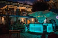 a bar in front of a house at night at Inkarri Cusco in Cusco