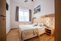 Posteľ alebo postele v izbe v ubytovaní Apartamenty Jasiowe Turnie nr 3 i nr 10 Krupówki 3km