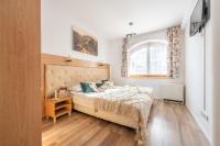 Posteľ alebo postele v izbe v ubytovaní Apartamenty Jasiowe Turnie nr 3 i nr 10 Krupówki 3km