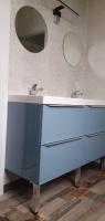 a bathroom with a blue sink and a mirror at Résidence Auger in Bourges