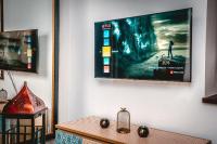 Televízia a/alebo spoločenská miestnosť v ubytovaní Queen Studio - LoftAffair