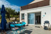 Patio lub wspólna przestrzeń na świeżym powietrzu w obiekcie Domaine Pedra Llampada Gîte Mer