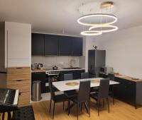 Kuchyňa alebo kuchynka v ubytovaní Appartement chic 5 min Disneyland/Vallée Village