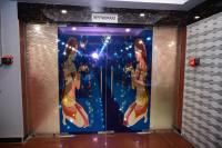 a door with a picture of girls on it at HOTEL GM INTERNATIONAL in Bodh Gaya