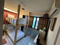 a bedroom with two bunk beds in a room at Boston Hotel in Chiayi City