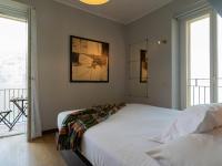 A bed or beds in a room at Mamma Ciccia Holiday Home - Sunset Balcony