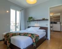 A bed or beds in a room at Mamma Ciccia Holiday Home - Sunset Balcony