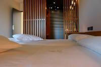 A bed or beds in a room at Hotel Raíz