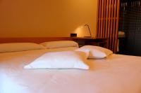 A bed or beds in a room at Hotel Raíz