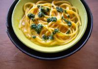 a bowl of pasta with broccoli on a table at Explora Valle Sagrado in Urubamba