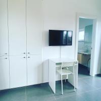 TV a/nebo společenská místnost v ubytování Villa Verano Apartamentos Compartidos Villaverde