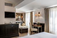 Palazzo Firenze by Baglioni Hotels & Resortsにあるベッド