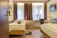 Hotel Alexander Zurich Old Townにあるテレビまたはエンターテインメントセンター