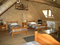Łóżko lub łóżka w pokoju w obiekcie Gîte Onze