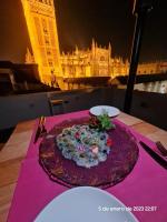 a cake sitting on top of a table with a building at Casa ART Sevilla in Seville