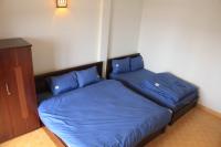 Ein Bett oder Betten in einem Zimmer der Unterkunft NHỚ House IV