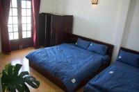 Ein Bett oder Betten in einem Zimmer der Unterkunft NHỚ House IV