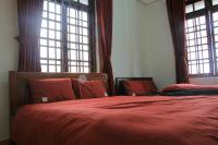 Ein Bett oder Betten in einem Zimmer der Unterkunft NHỚ House IV