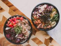 two bowls of food sitting on a table at Ilikai Lite in Honolulu