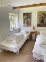 Postel nebo postele na pokoji v ubytování Mellem-rummet Guesthouse & Glamping