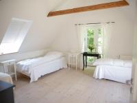 Postel nebo postele na pokoji v ubytování Mellem-rummet Guesthouse & Glamping
