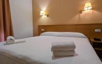 A bed or beds in a room at Hotel Santa Faz