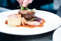 un plato blanco con un trozo de postre encima en George Albert Hotel & Spa, en Dorchester