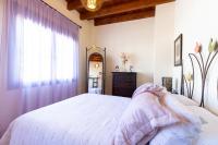 Łóżko lub łóżka w pokoju w obiekcie vll Vivienda rural a las puertas de Doñana