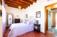 Łóżko lub łóżka w pokoju w obiekcie vll Vivienda rural a las puertas de Doñana