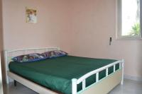 A bed or beds in a room at Casa x5 con barbecue LL09 a San Foca