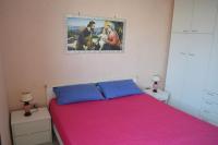 A bed or beds in a room at Casa x5 con barbecue LL09 a San Foca