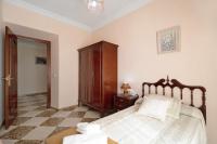 A bed or beds in a room at Casa Macarena