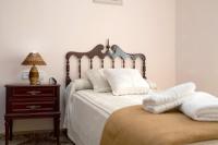 A bed or beds in a room at Casa Macarena