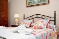 A bed or beds in a room at Casa Macarena