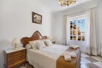 A bed or beds in a room at Casa Macarena
