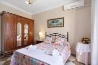 A bed or beds in a room at Casa Macarena