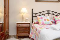 A bed or beds in a room at Casa Macarena