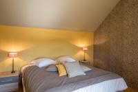 a bedroom with a large bed with two lamps at Chez Joseph - Au coeur des vignes de Saint-Romain in Saint-Romain