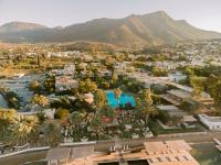 an aerial view of a resort with mountains in the background at Flamm in Golturkbuku