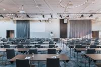 a classroom with tables and chairs in a room at Courtyard by Marriott Stockholm Kungsholmen in Stockholm